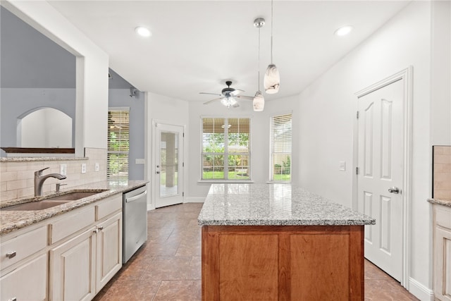 600 Rocky Xing, Fayetteville, AR 72704 - kitchen with dishwasher, a sink, a ceiling fan, backsplash, and light tile patterned floors