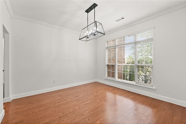 600 Rocky Xing, Fayetteville, AR 72704 - empty room with crown molding, a chandelier, wood finished floors, and baseboards