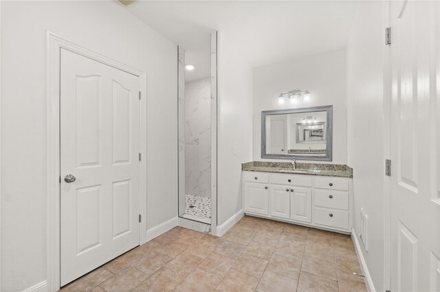 600 Rocky Xing, Fayetteville, AR 72704 - full bath featuring a marble finish shower, vanity, baseboards, and tile patterned floors