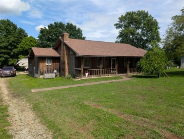 208 Mc 6087, Yellville, AR 72687 - view of front of home with covered porch, a front yard, and a chimney