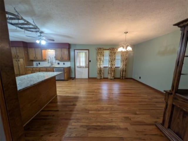 208 Mc 6087, Yellville, AR 72687 - kitchen featuring a ceiling fan, wood finished floors, dishwasher, light countertops, and a textured ceiling