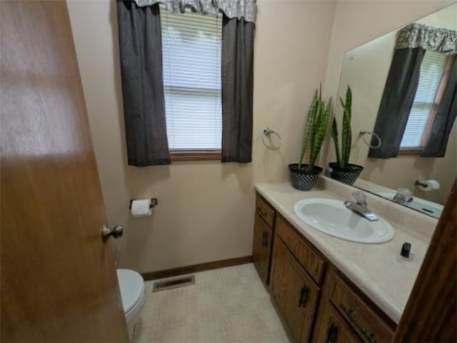 208 Mc 6087, Yellville, AR 72687 - bathroom featuring toilet, vanity, and baseboards