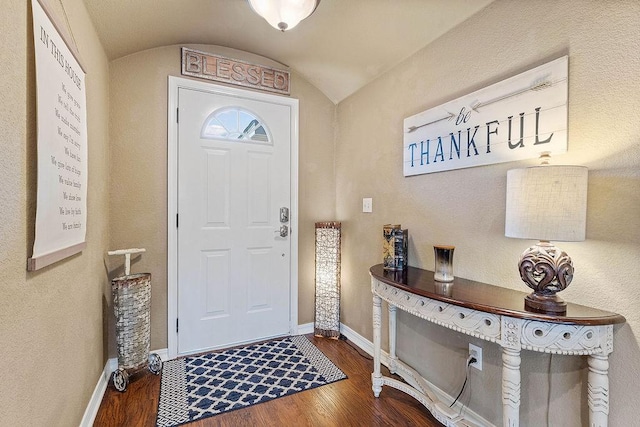 801 SW Castlewood St, Bentonville, AR 72712 - foyer featuring wood finished floors, lofted ceiling, and baseboards