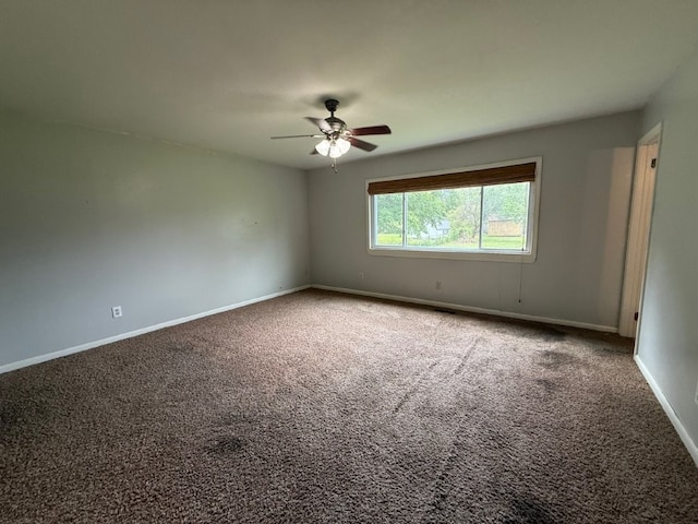 1902 W Granite St, Siloam Springs, AR 72761 - unfurnished room with carpet floors, baseboards, and a ceiling fan