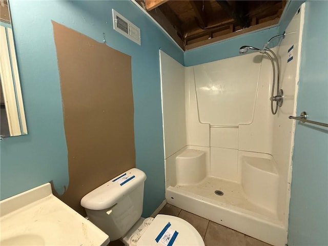1902 W Granite St, Siloam Springs, AR 72761 - bathroom featuring tile patterned flooring, vanity, toilet, and a shower