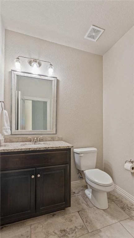 809 Ravine St, Cave Springs, AR 72718 - bathroom with toilet, vanity, and baseboards