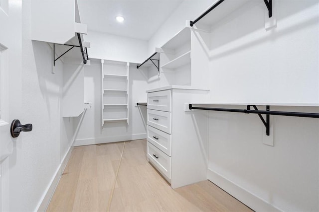 7101 SW Basswood Ave, Bentonville, AR 72713 - walk in closet featuring light wood-type flooring