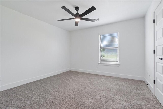 7101 SW Basswood Ave, Bentonville, AR 72713 - carpeted empty room with baseboards and ceiling fan