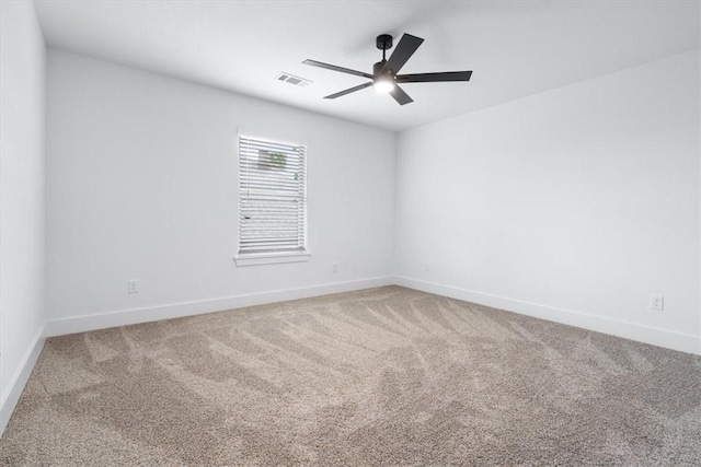 7101 SW Basswood Ave, Bentonville, AR 72713 - empty room featuring ceiling fan, carpet flooring, and baseboards