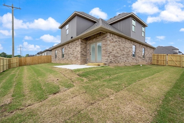 7101 SW Basswood Ave, Bentonville, AR 72713 - back of house with brick siding, a patio area, and a shingled roof