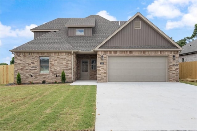 7101 SW Basswood Ave, Bentonville, AR 72713 - craftsman-style home featuring concrete driveway, brick siding, a garage, roof with shingles, and board and batten siding