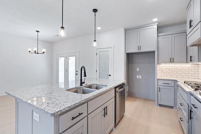 7101 SW Basswood Ave, Bentonville, AR 72713 - kitchen with a sink, dishwasher, gray cabinets, light wood-type flooring, and recessed lighting