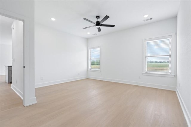 7101 SW Basswood Ave, Bentonville, AR 72713 - unfurnished room featuring light wood-style floors, ceiling fan, baseboards, and recessed lighting