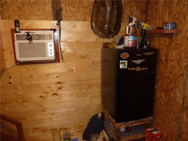 396 Dawn Light Dr, Western Grove, AR 72675 - detailed view of freestanding refrigerator and wooden walls