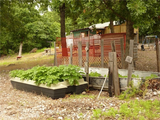 396 Dawn Light Dr, Western Grove, AR 72675 - view of jungle gym with a vegetable garden