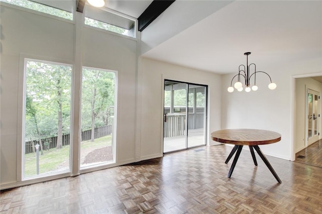 1588 N Tanglebriar Ln, Fayetteville, AR 72701 - dining space with a towering ceiling, a chandelier, and baseboards
