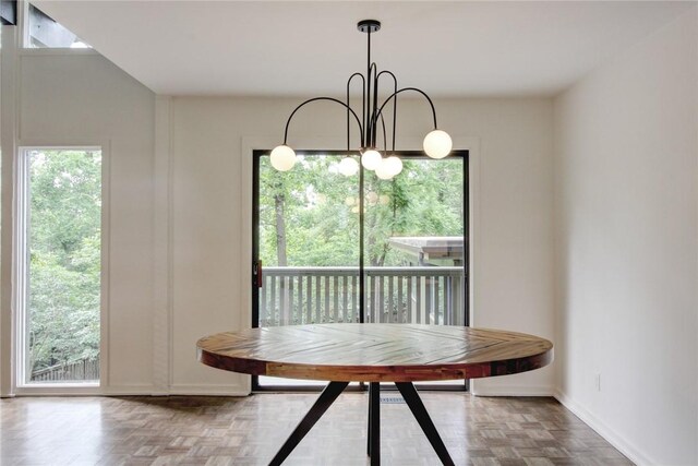 1588 N Tanglebriar Ln, Fayetteville, AR 72701 - dining area with baseboards and a chandelier