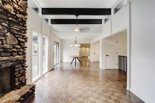 1588 N Tanglebriar Ln, Fayetteville, AR 72701 - corridor with a chandelier, beamed ceiling, and baseboards