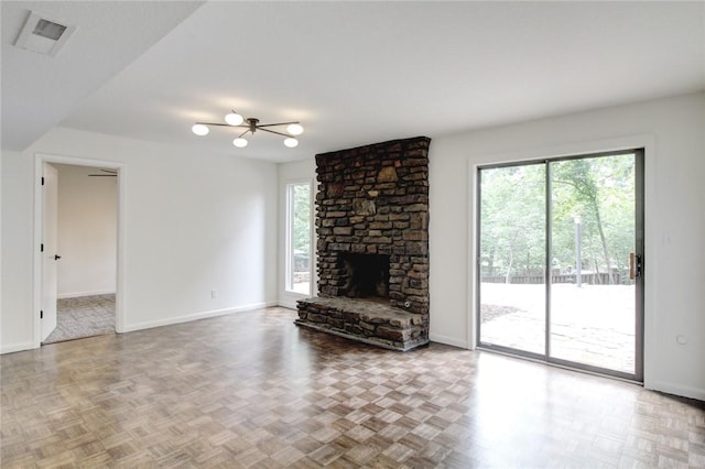 1588 N Tanglebriar Ln, Fayetteville, AR 72701 - unfurnished living room featuring baseboards and a stone fireplace