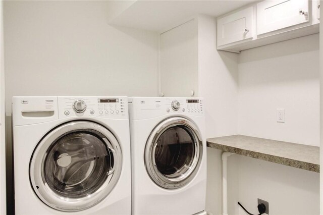 1588 N Tanglebriar Ln, Fayetteville, AR 72701 - laundry area featuring cabinet space and independent washer and dryer