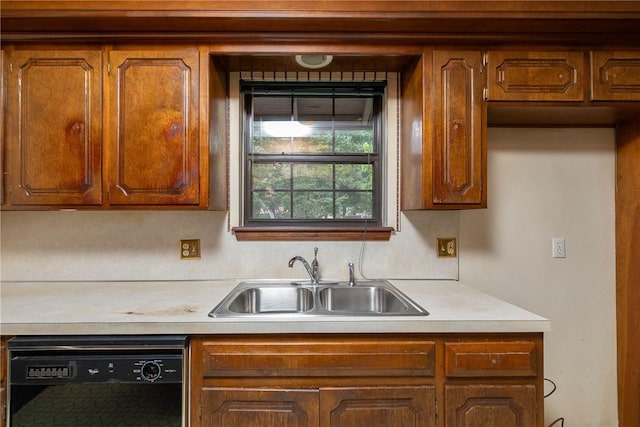 1719 Ridgeview Dr, Springdale, AR 72762 - kitchen with black dishwasher, a sink, light countertops, and brown cabinets