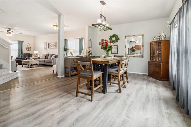 1017 Richland Creek Ave, Elkins, AR 72727 - dining room with wood finished floors, ceiling fan, stairway, and baseboards