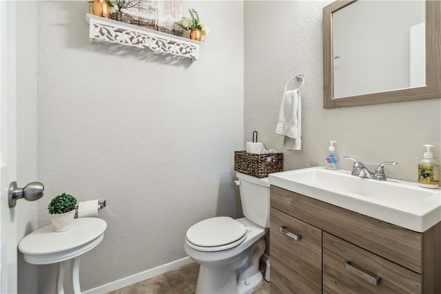 1017 Richland Creek Ave, Elkins, AR 72727 - bathroom featuring toilet, vanity, baseboards, and tile patterned floors