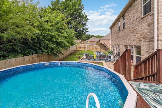 1017 Richland Creek Ave, Elkins, AR 72727 - view of swimming pool with outdoor lounge area, a deck, and a fenced backyard