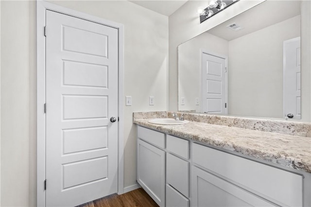 851 E Sparrow Cir, Fayetteville, AR 72701 - bathroom featuring vanity, wood finished floors, and baseboards
