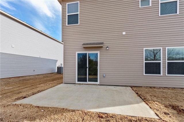 851 E Sparrow Cir, Fayetteville, AR 72701 - rear view of house with central AC and a patio