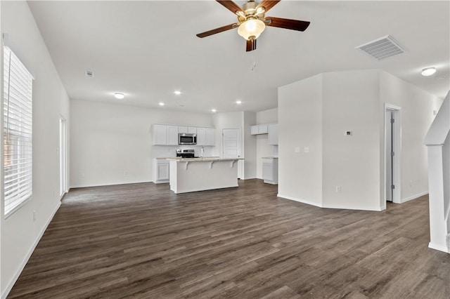 851 E Sparrow Cir, Fayetteville, AR 72701 - unfurnished living room featuring ceiling fan, dark wood finished floors, recessed lighting, and baseboards