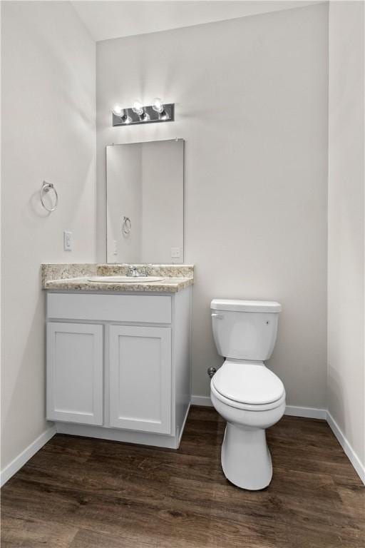 851 E Sparrow Cir, Fayetteville, AR 72701 - bathroom with vanity, baseboards, toilet, and wood finished floors