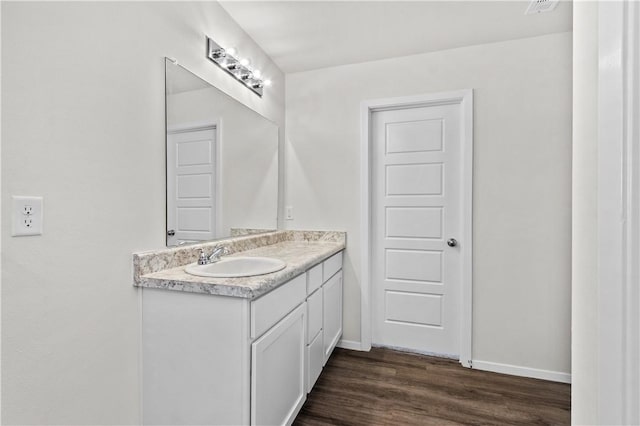 851 E Sparrow Cir, Fayetteville, AR 72701 - bathroom with vanity, wood finished floors, and baseboards