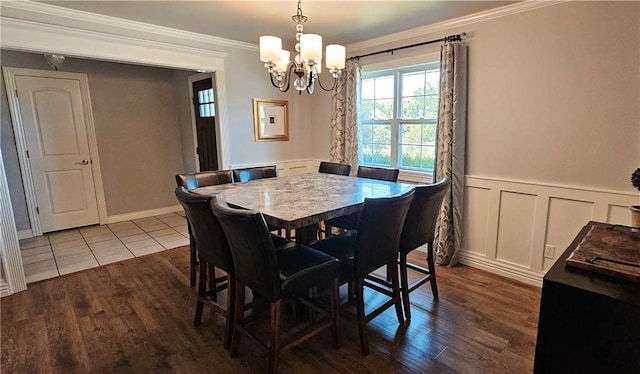 4158 N Rocky Ridge Trl, Rogers, AR 72756 - dining room with ornamental molding, a chandelier, wood finished floors, wainscoting, and a decorative wall