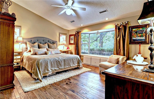 811 E Township St, Fayetteville, AR 72703 - bedroom with a textured ceiling, wood-type flooring, vaulted ceiling, recessed lighting, and a ceiling fan
