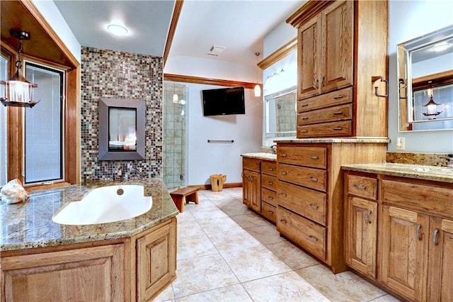 811 E Township St, Fayetteville, AR 72703 - bathroom with vanity, a bath, a tile shower, and tile patterned floors