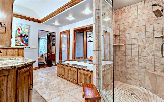 811 E Township St, Fayetteville, AR 72703 - full bathroom with crown molding, a stall shower, tile patterned flooring, vanity, and a garden tub