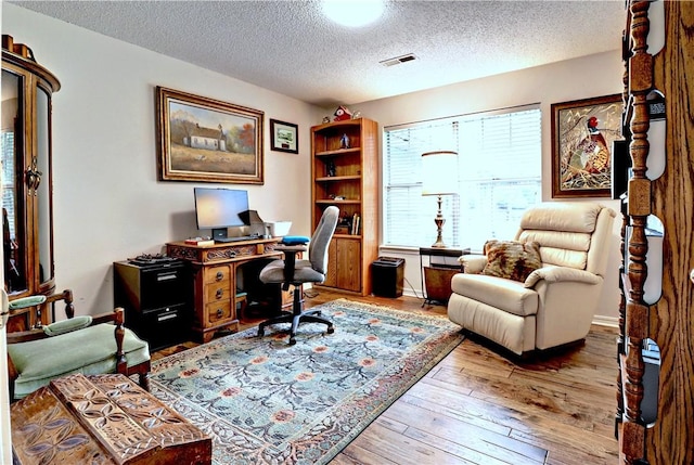 811 E Township St, Fayetteville, AR 72703 - office area with a textured ceiling and hardwood / wood-style flooring