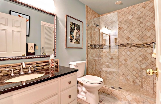 811 E Township St, Fayetteville, AR 72703 - bathroom featuring vanity, toilet, and a stall shower