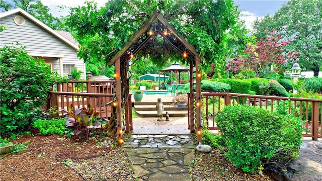 811 E Township St, Fayetteville, AR 72703 - wooden deck featuring an outdoor pool and a gazebo