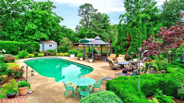 811 E Township St, Fayetteville, AR 72703 - view of pool featuring a gazebo, outdoor dining space, a patio, and view of scattered trees