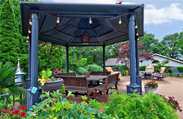 811 E Township St, Fayetteville, AR 72703 - view of patio featuring a gazebo, outdoor dining area, and a deck
