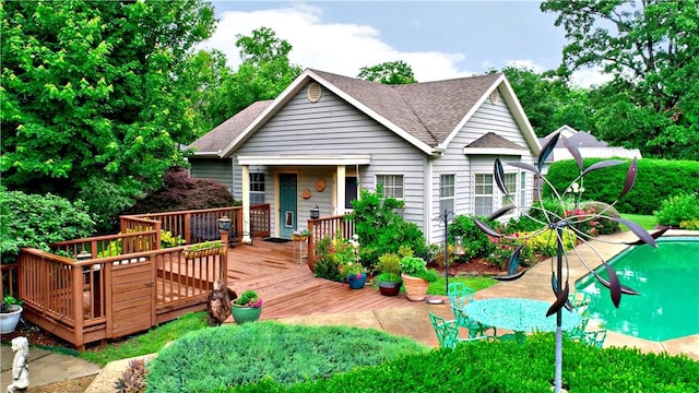 811 E Township St, Fayetteville, AR 72703 - view of front of house featuring a wooden deck and roof with shingles