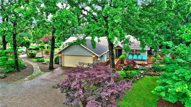 811 E Township St, Fayetteville, AR 72703 - view of front of property with concrete driveway, an attached garage, and a wooden deck