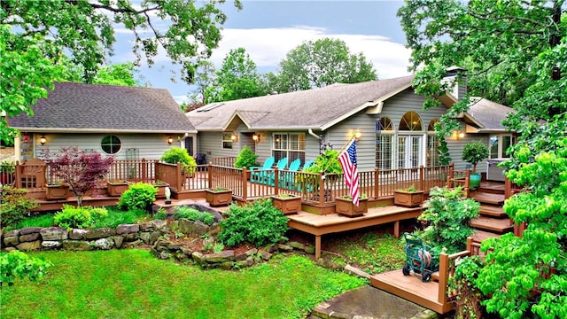 811 E Township St, Fayetteville, AR 72703 - rear view of property with a chimney, a wooden deck, and a shingled roof