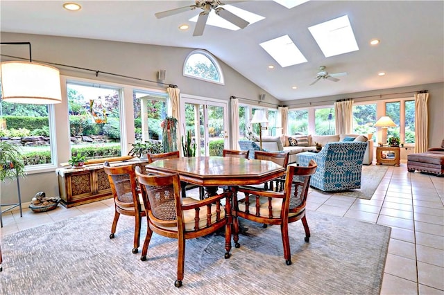 811 E Township St, Fayetteville, AR 72703 - dining area with a ceiling fan, a skylight, lofted ceiling, plenty of natural light, and light tile patterned floors