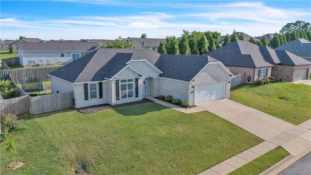 1461 Colonel Mcneil Dr, Prairie Grove, AR 72753 - view of front facade with an attached garage, a residential view, brick siding, and concrete driveway