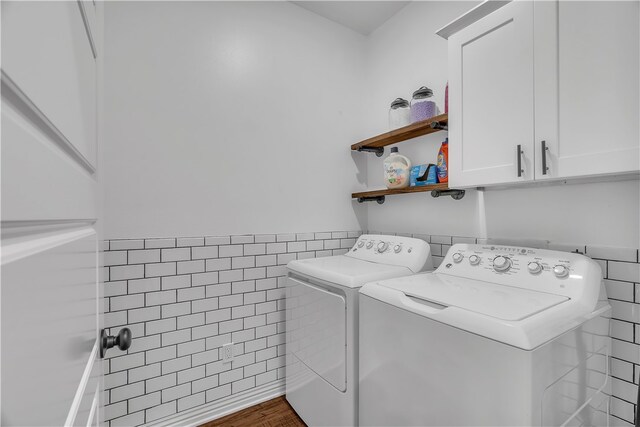1461 Colonel Mcneil Dr, Prairie Grove, AR 72753 - laundry area featuring tile walls, washer and dryer, cabinet space, and wainscoting