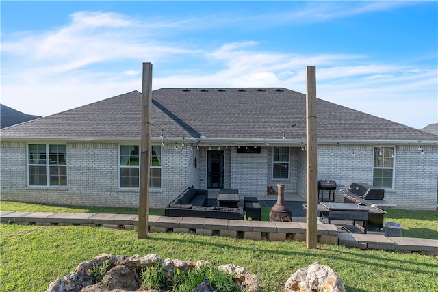 1461 Colonel Mcneil Dr, Prairie Grove, AR 72753 - rear view of property featuring a yard, brick siding, a shingled roof, and an outdoor hangout area