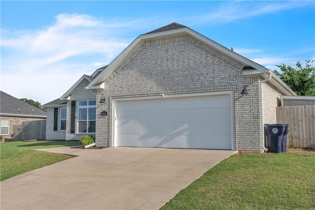 1461 Colonel Mcneil Dr, Prairie Grove, AR 72753 - view of front of house with brick siding, a garage, and driveway